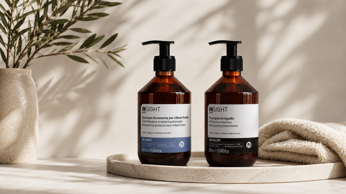 Insight Blonde Brightening Shampoo and Insight Incolor Anti-Yellow Shampoo on a neutral bathroom vanity, professional purple shampoos designed to neutralise brassy and yellow tones in blonde, highlighted and grey hair.